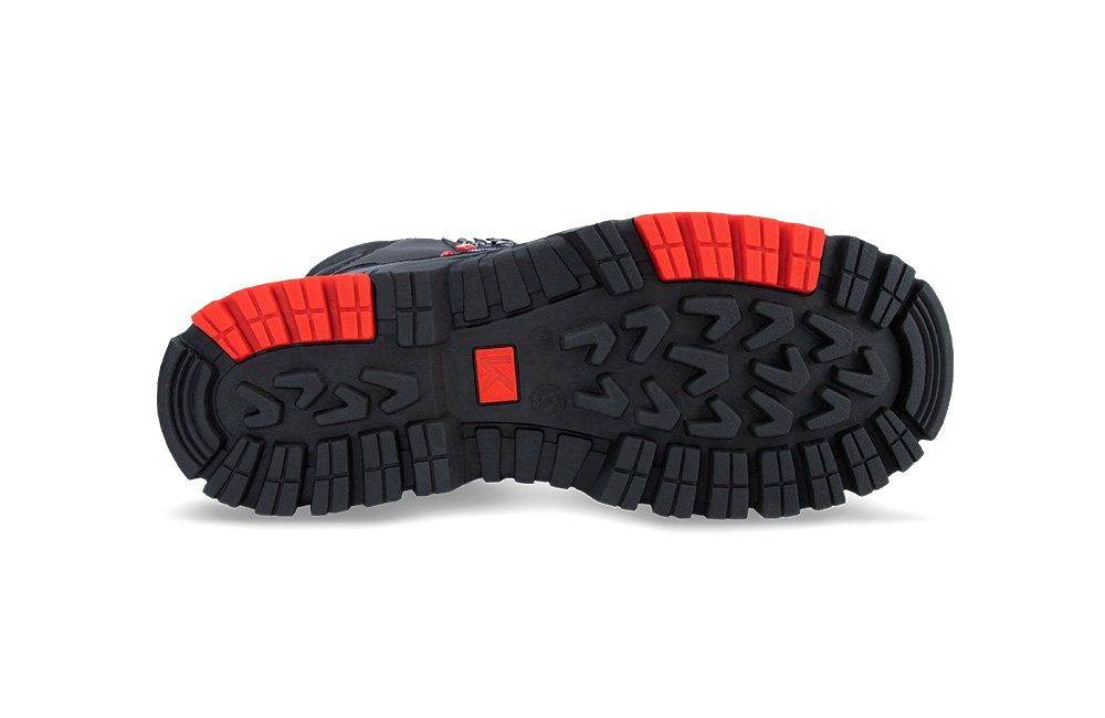 A close up of the bottom of a shoe on a white background.