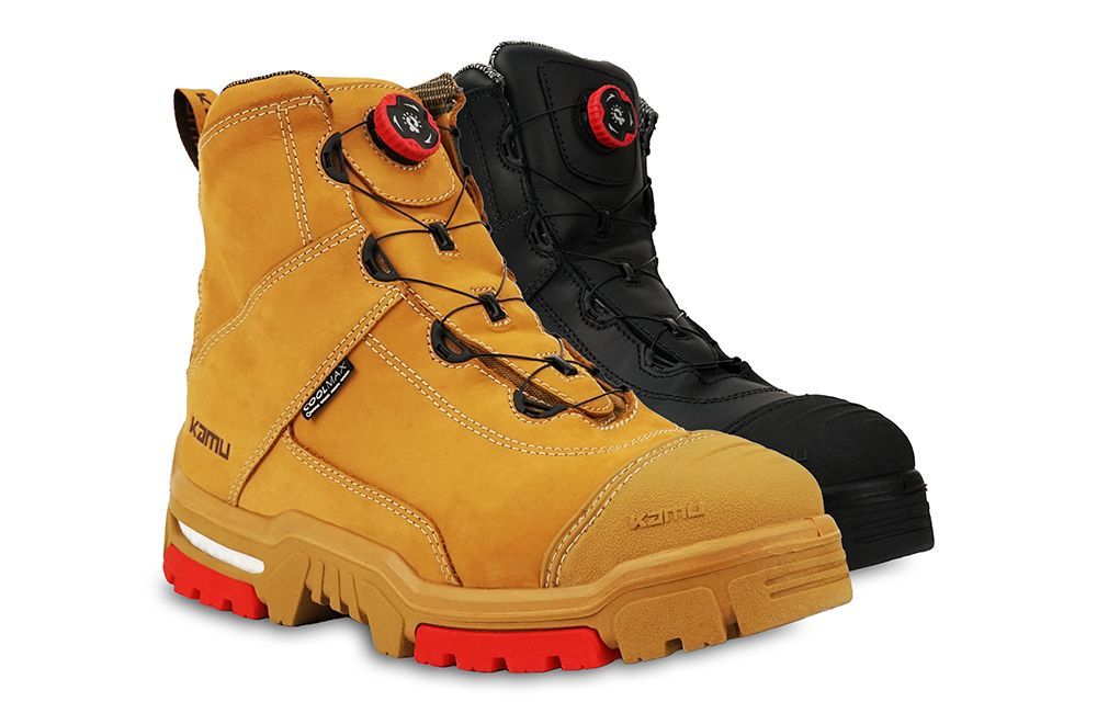 A pair of yellow and black safety boots on a white background.