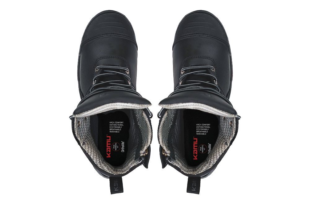 A pair of black boots with the inside of the shoe showing.