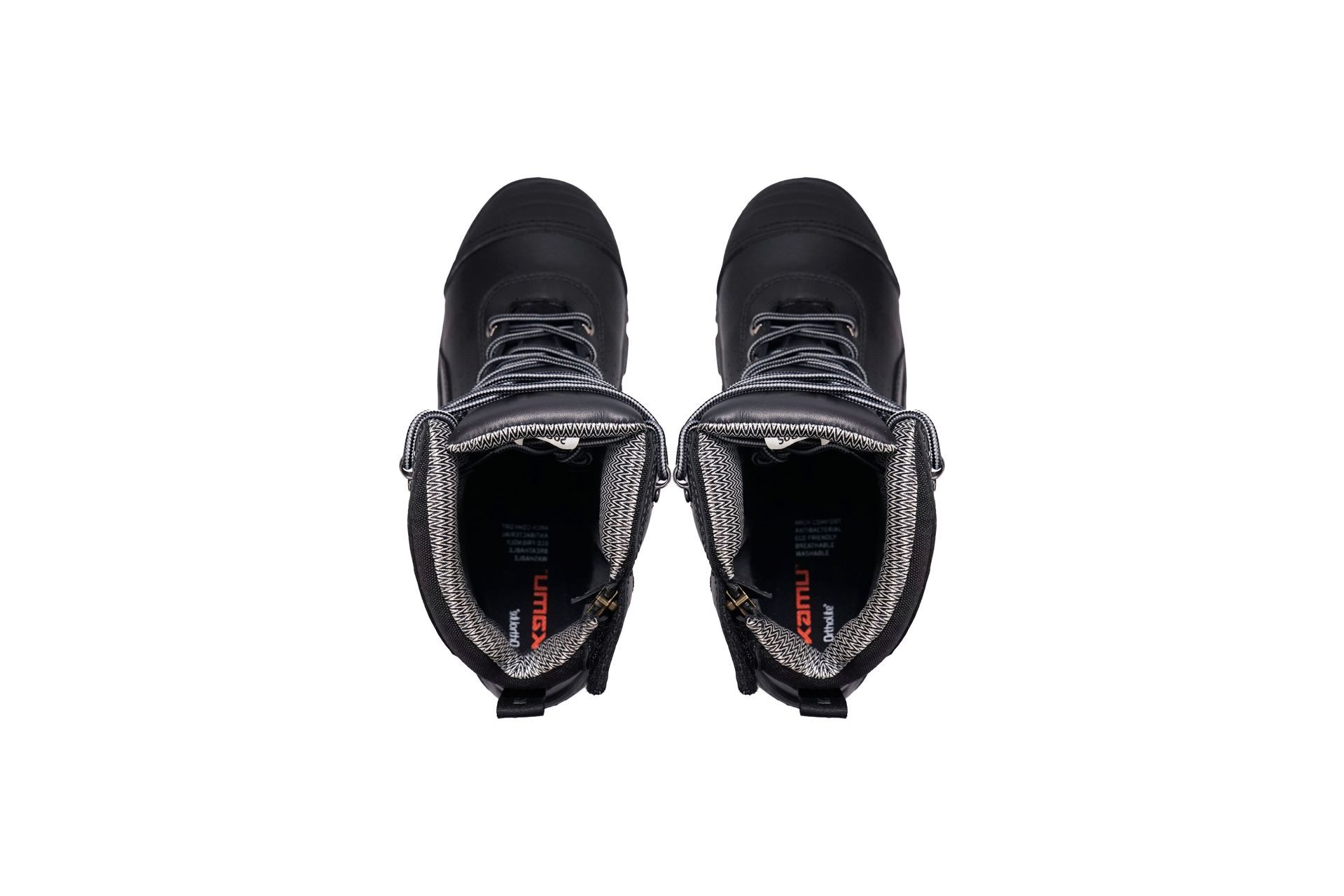 The inside of a pair of black boots on a white background.