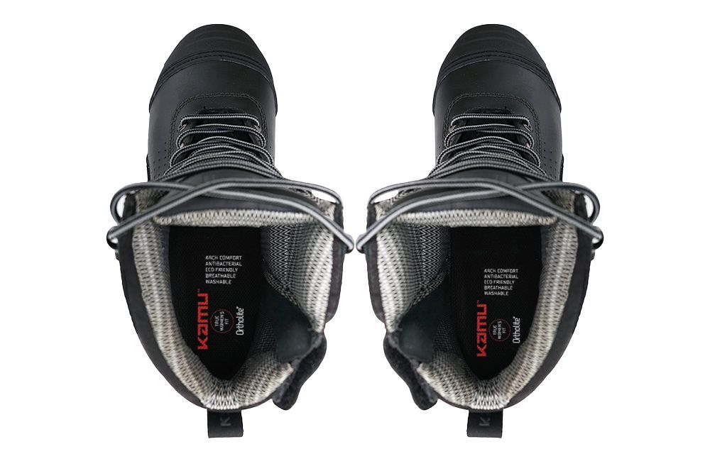 A pair of black boots are shown from above on a white background.