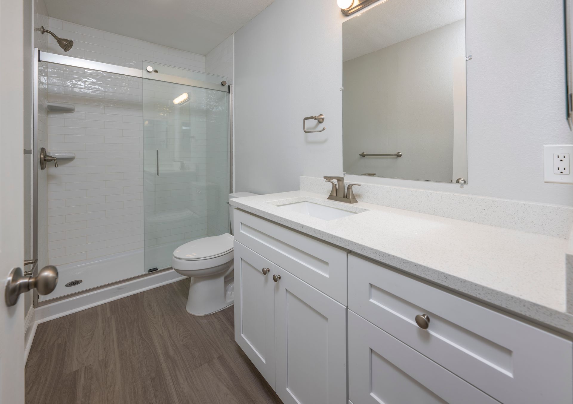 Full bathroom with glass door shower