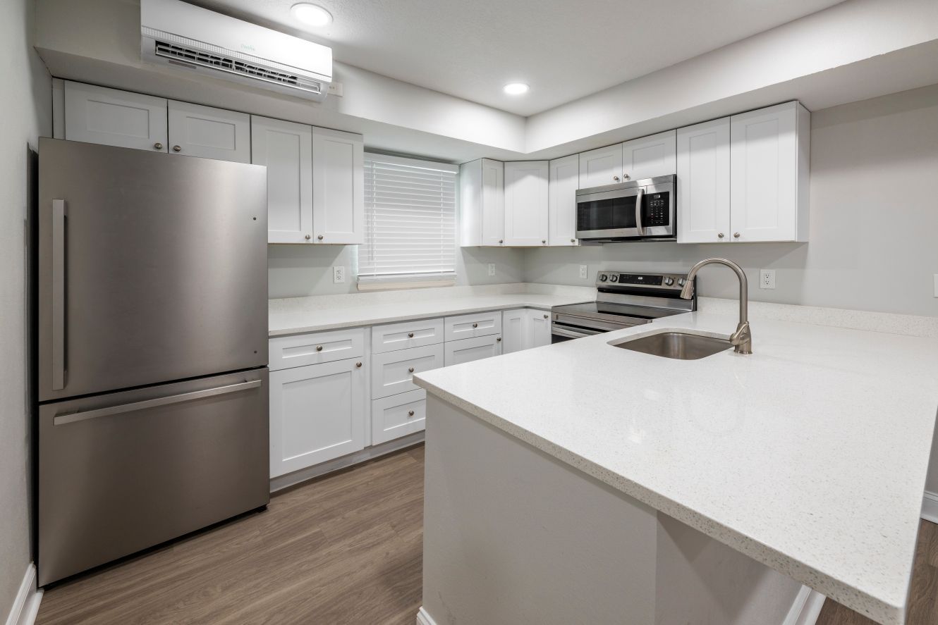 modern kitchen with stainless steel fridge