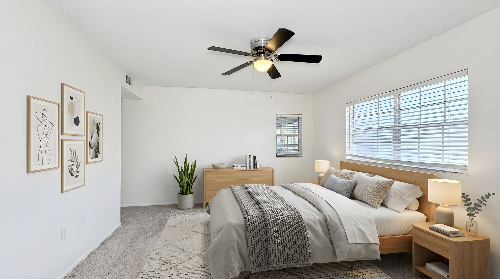 bedroom with white walls, carpet and bed