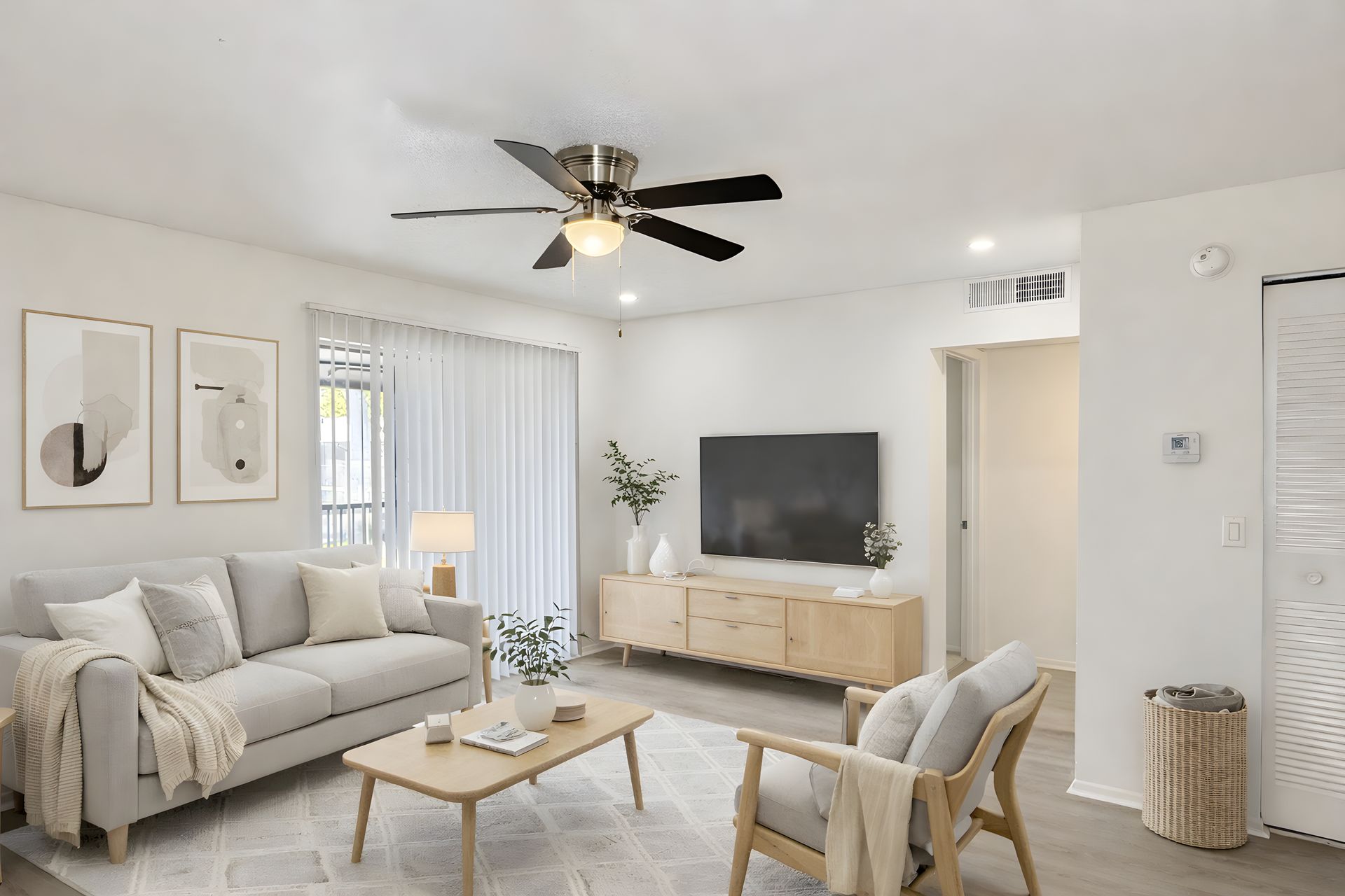 apartment living room with neutral colored furnishings