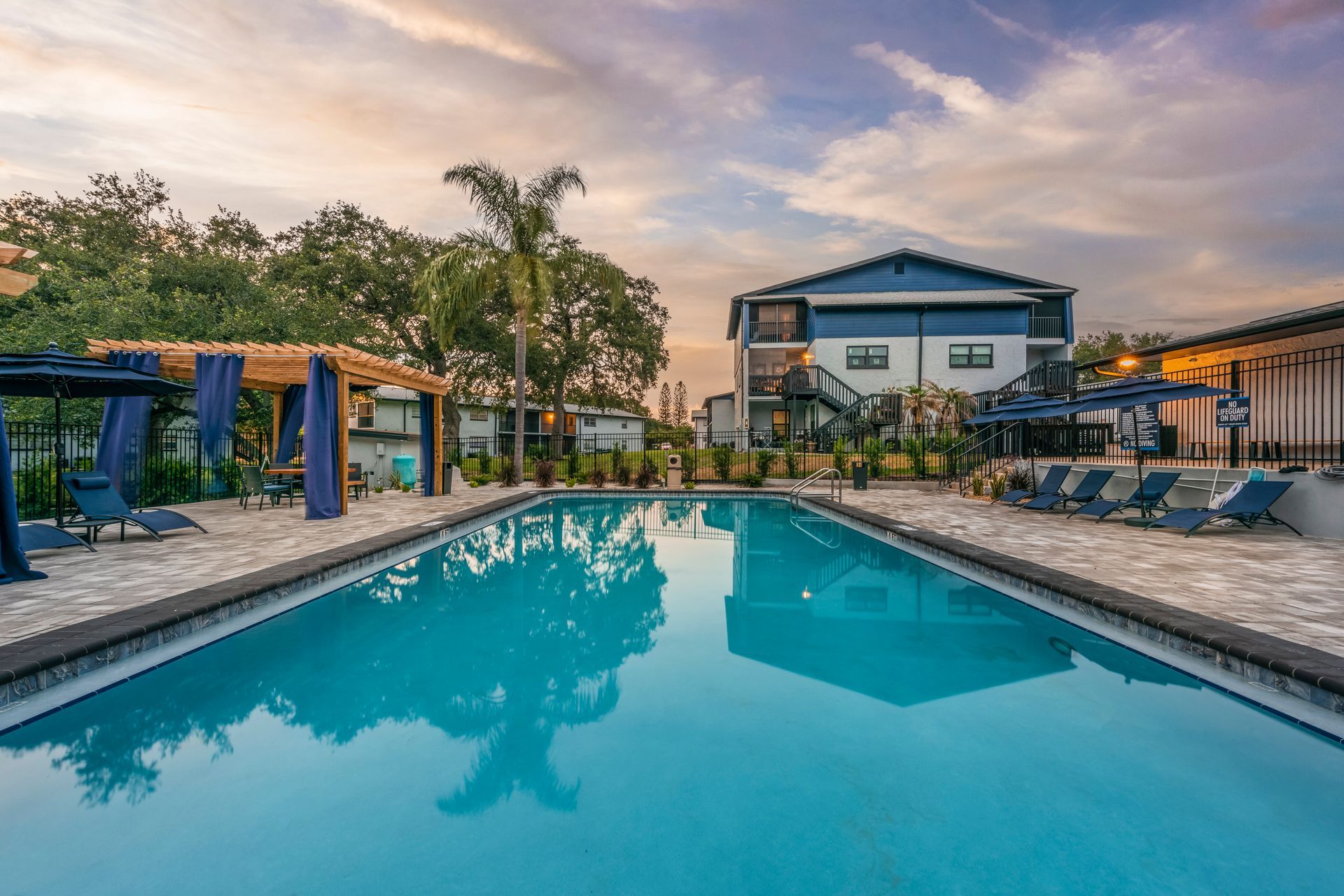Pool and cabana area, and an apartment building