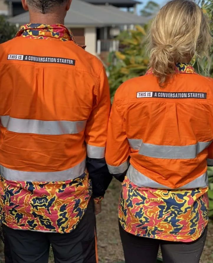 A Man And A Woman Are Standing Next To Each — Chris Hackett Tree Services In Byron Bay, NSW