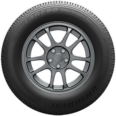 Black car tire with dark gray alloy wheel on a white background