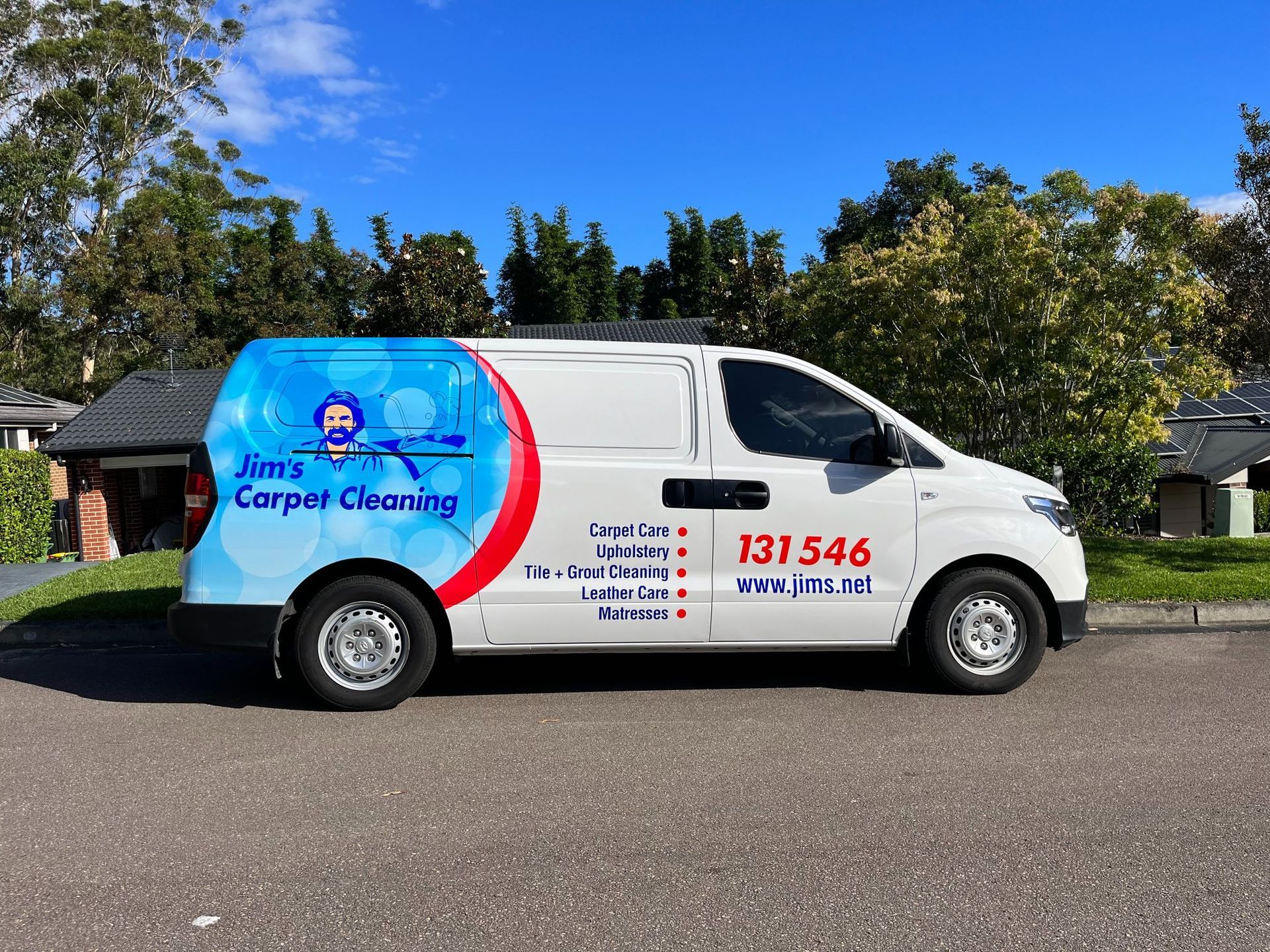 White Van with Jim's Carpet Cleaning Logo, Parked on A Street — Stuckup Industries in Morisset, NSW