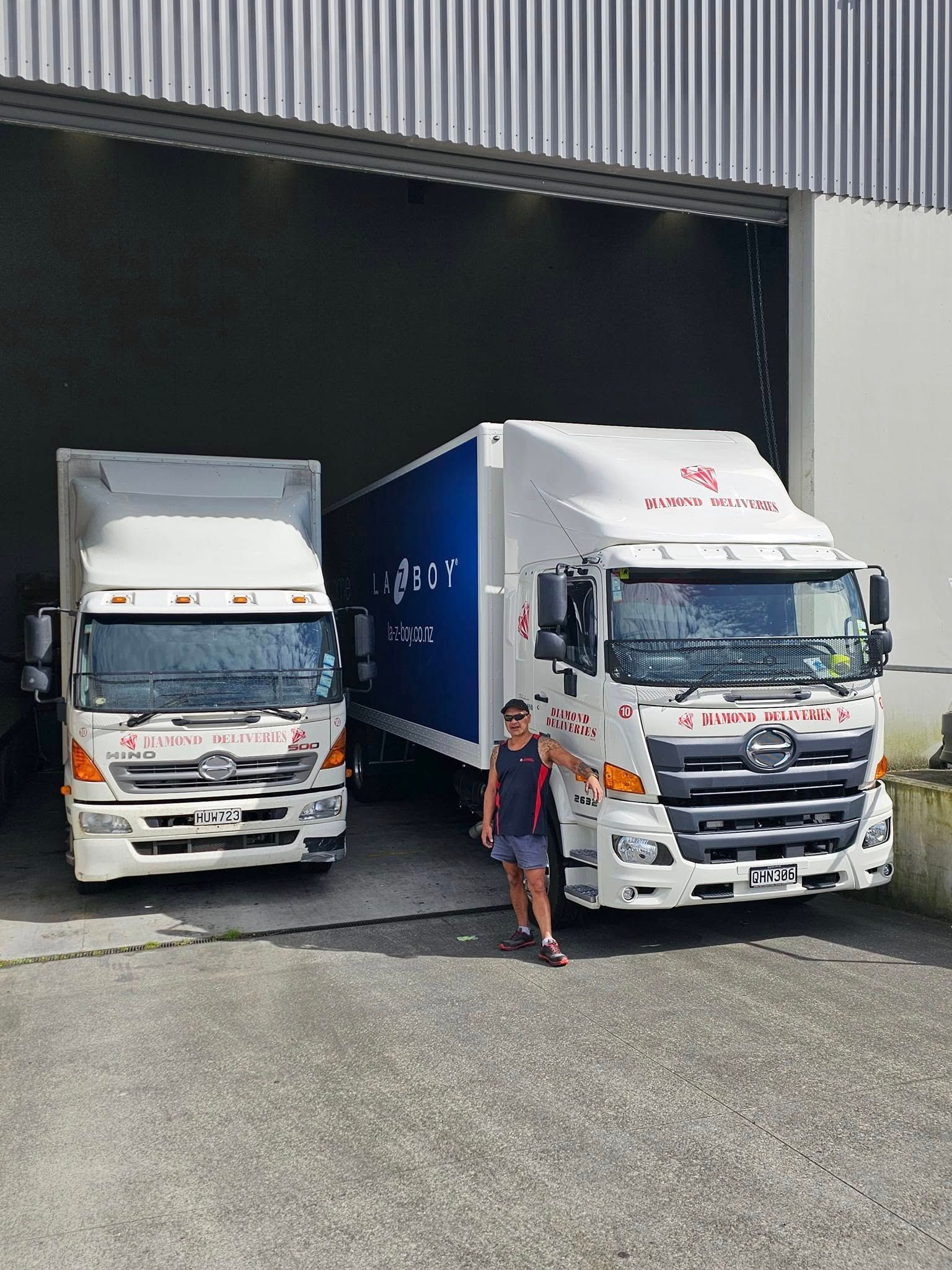Two trucks are parked next to each other with the text loading up and shipping out