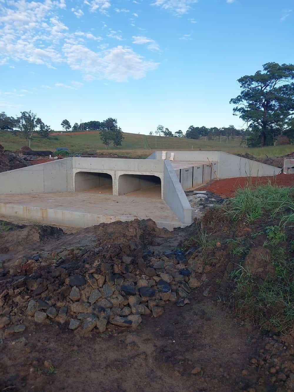 A Concrete Structure Is Being Built In The Middle Of A Field — J & M Bashforth & Sons In Brunswick Heads, NSW
