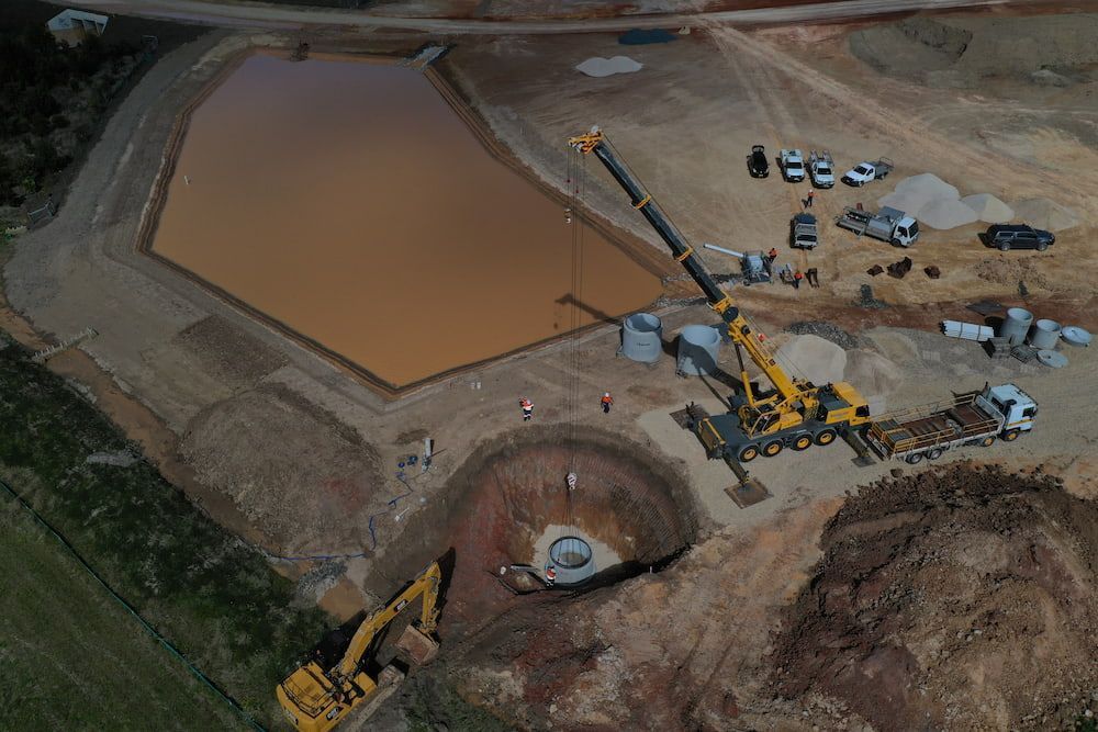 An Aerial View Of A Construction Site With A Crane And Excavators — J & M Bashforth & Sons In Brunswick Heads, NSW