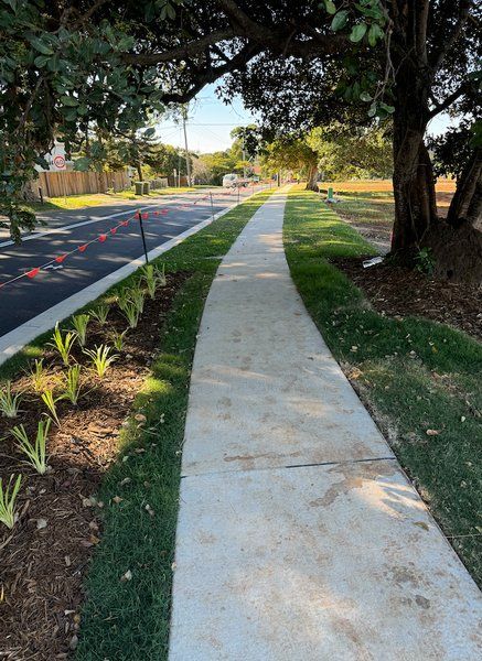 FootPath With Trees To The Right— J & M Bashforth & Sons In Brunswick Heads, NSW