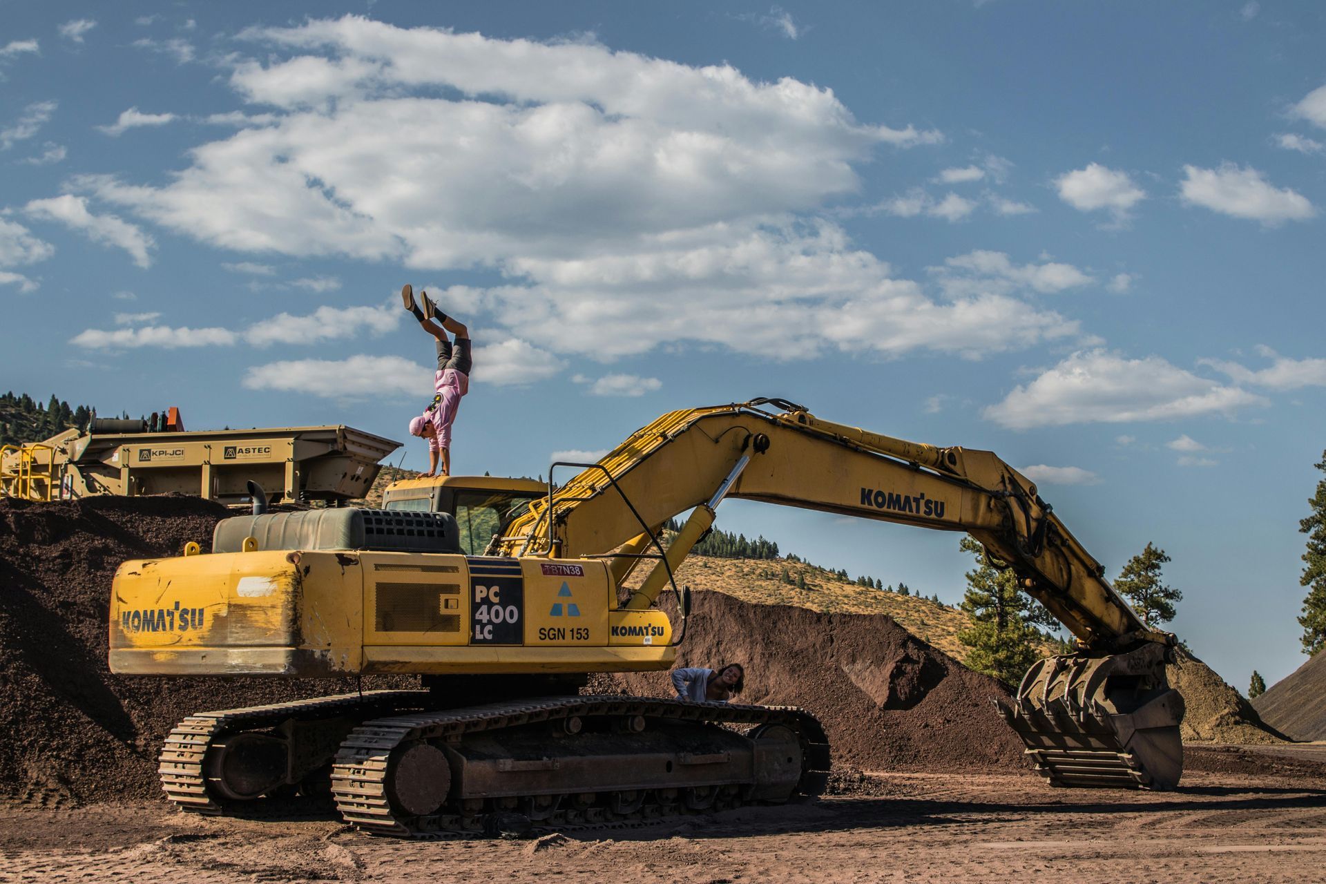 A Large Yellow Excavator Is Sitting on Top of A Pile of Dirt — J & M Bashforth & Sons In Tweed Heads, NSW