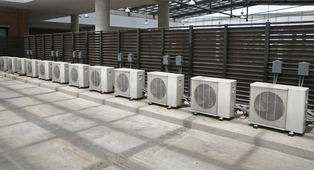 Row of Outdoor Air Conditioning Units — A Step Above Electrical & Air Conditioning In Edmonton, QLD