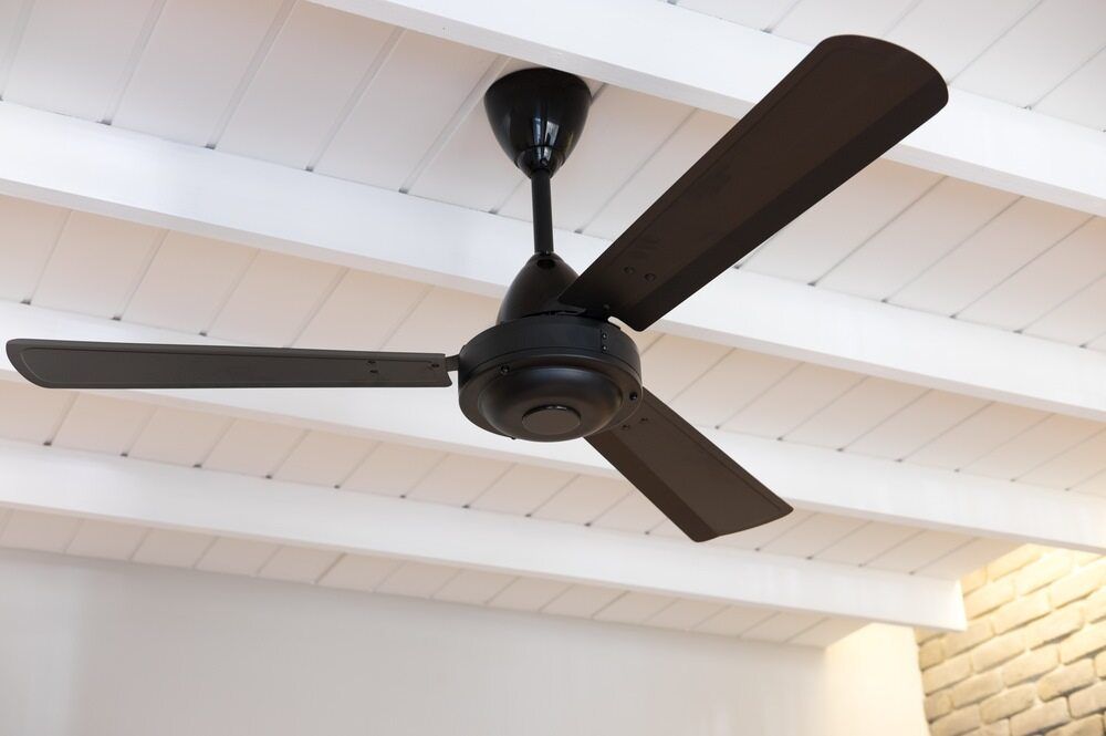 Dark Ceiling Fan With Three Blades — A Step Above Electrical & Air Conditioning In Edmonton, QLD
