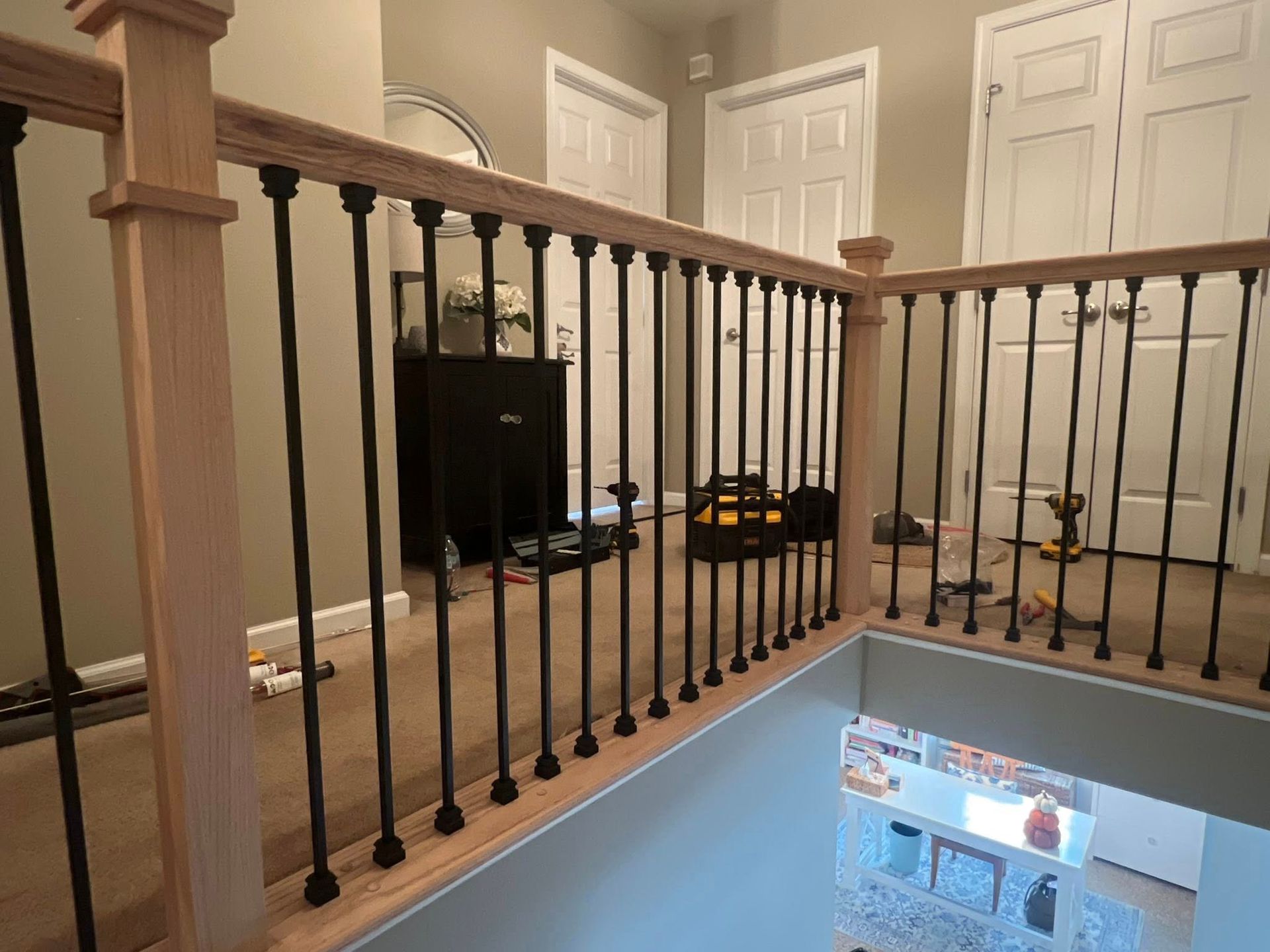 metal spindles added to stair railing