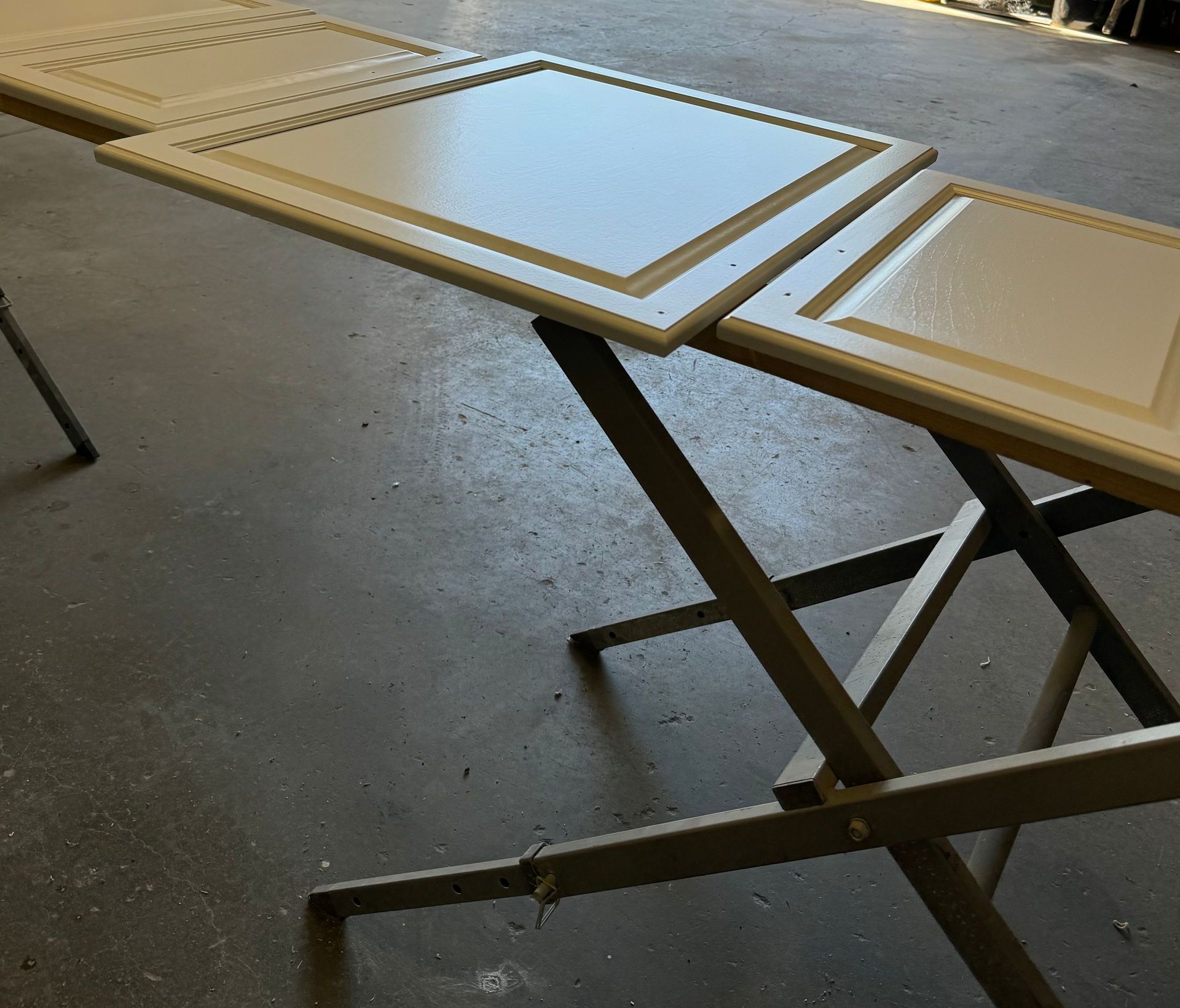 cabinet doors being refinished to a cream color