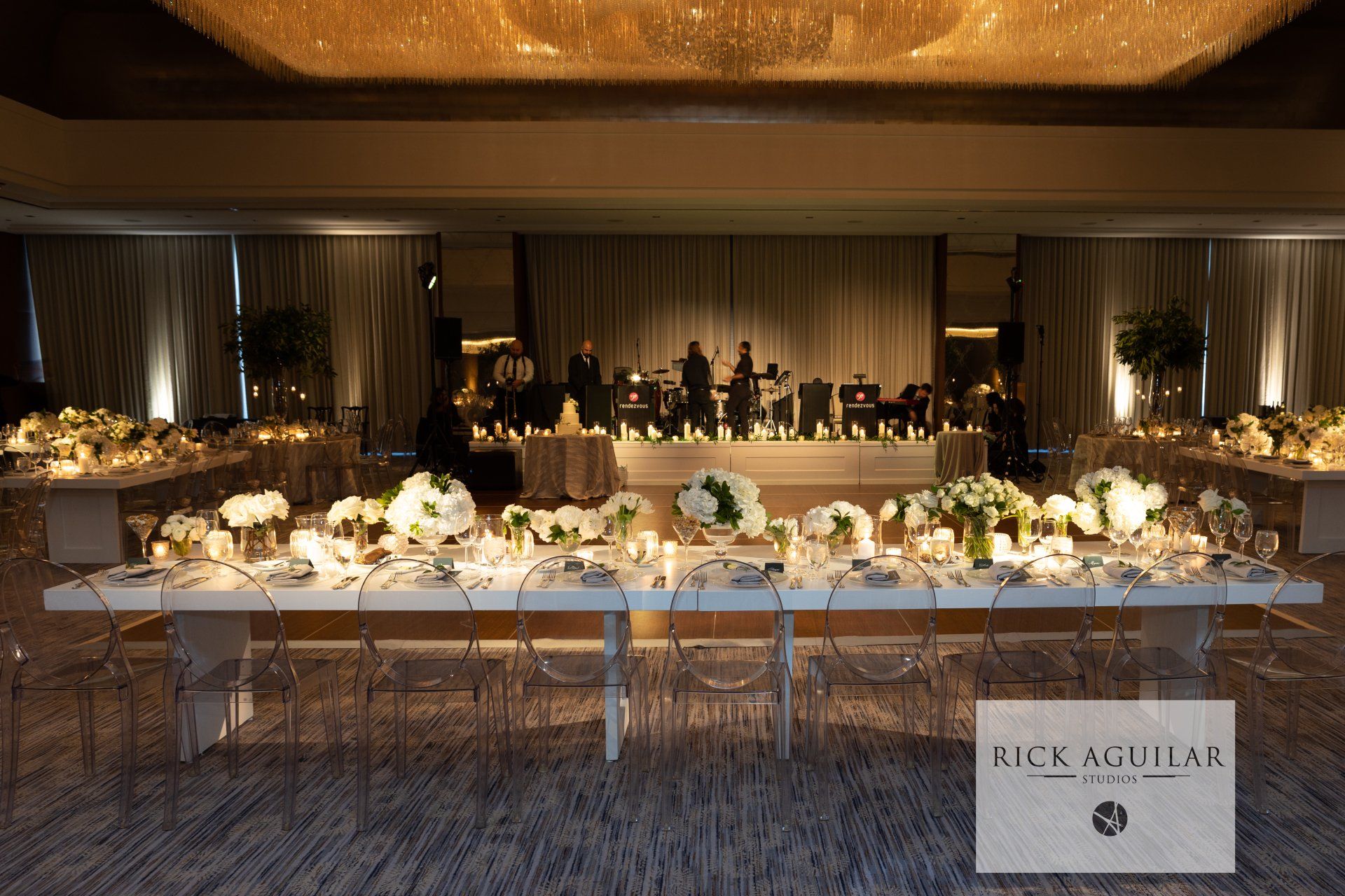 A long table with flowers and candles in a room
