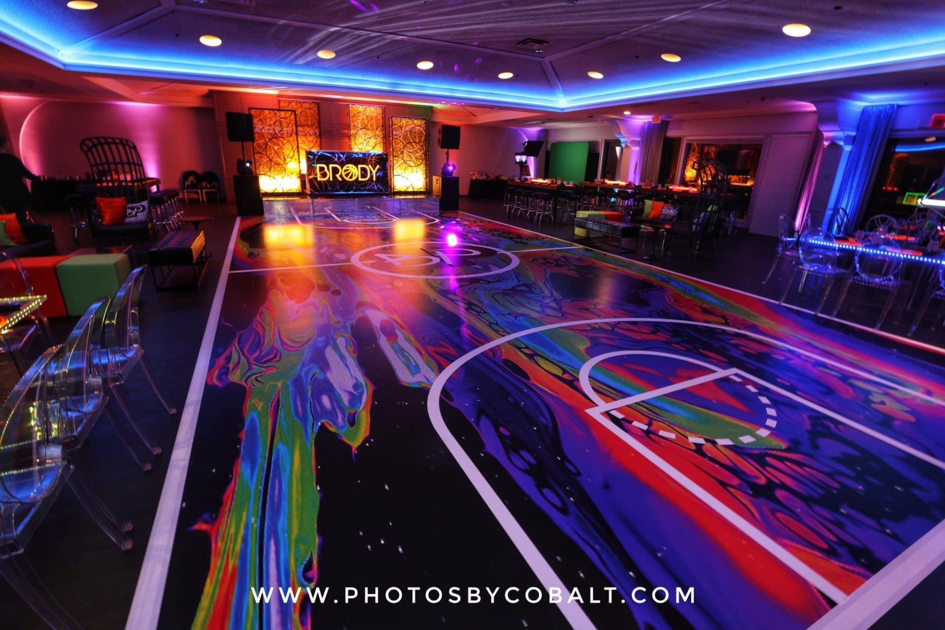A dance floor with a basketball court painted on it