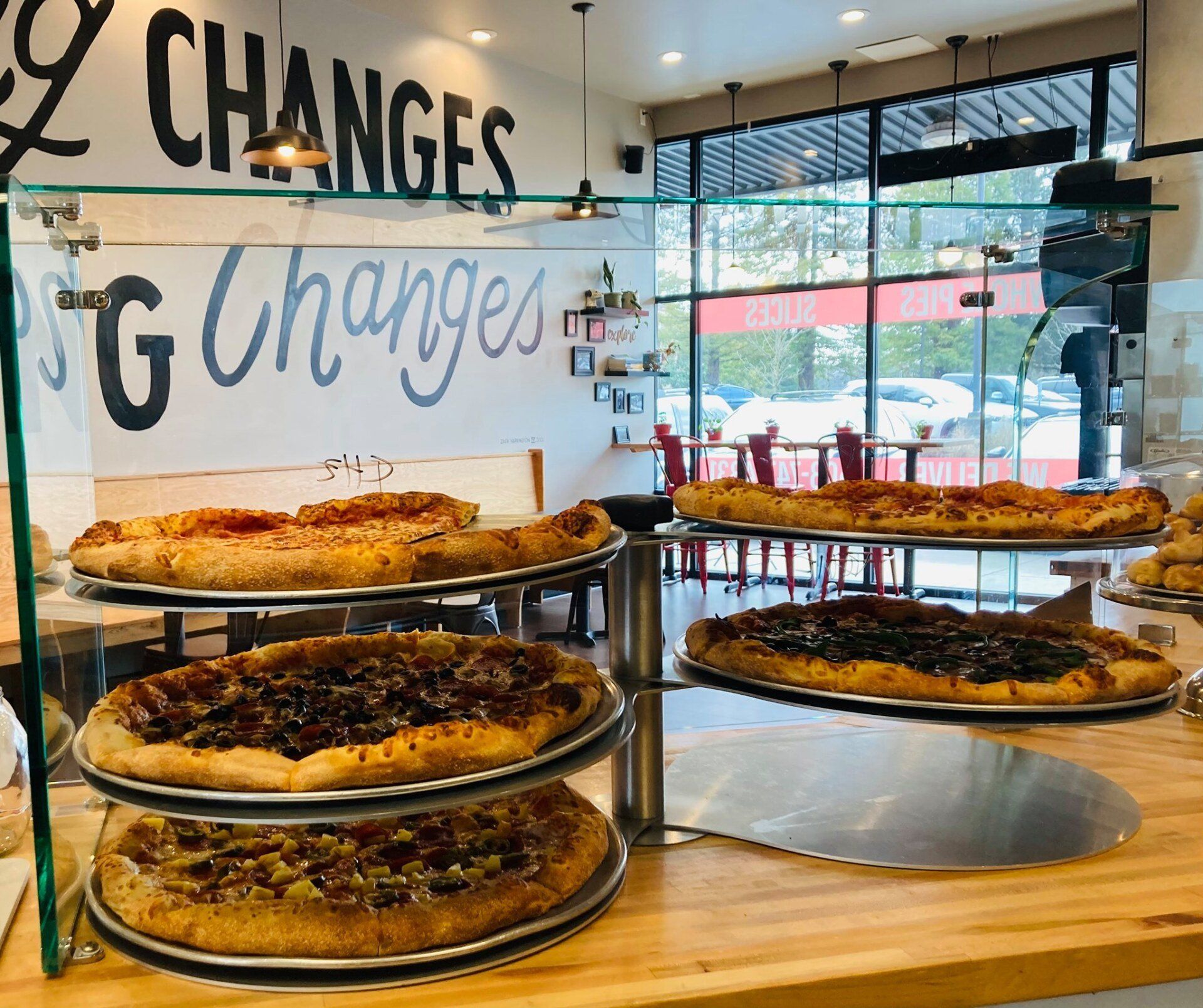 Counter view of pizza for sale.