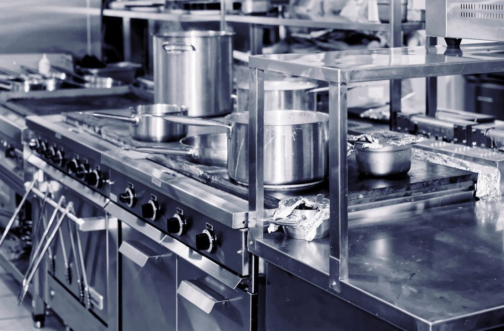 A Kitchen With a Lot of Pots and Pans on the Stove — Commercial Kitchens Direct in Sutherland Shire, NSW