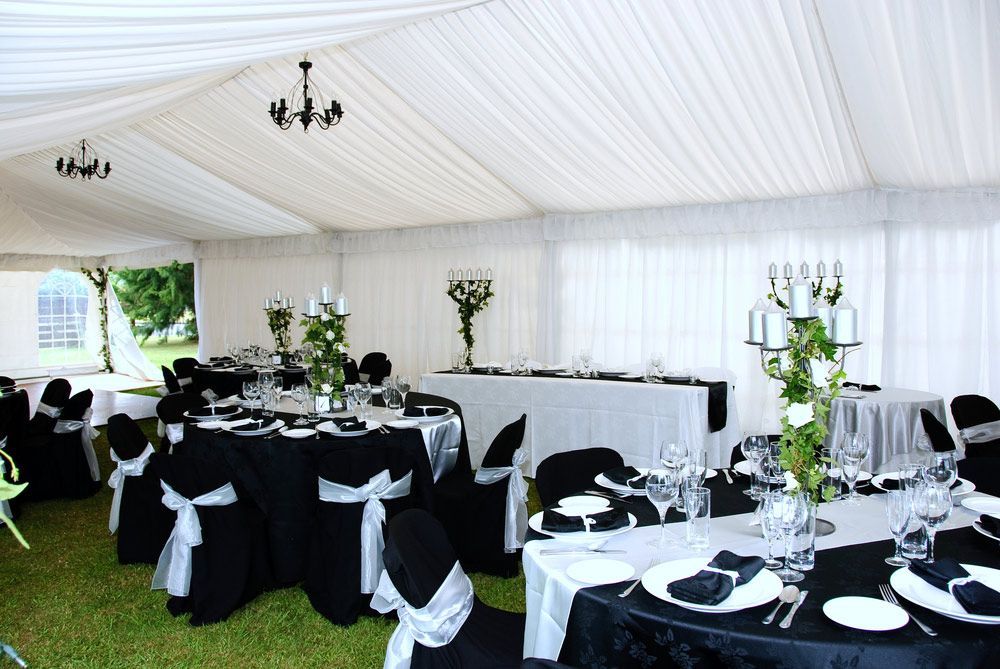 A White Tent With Black and White Tables and Chairs — Commercial Kitchens Direct in Sutherland Shire, NSW
