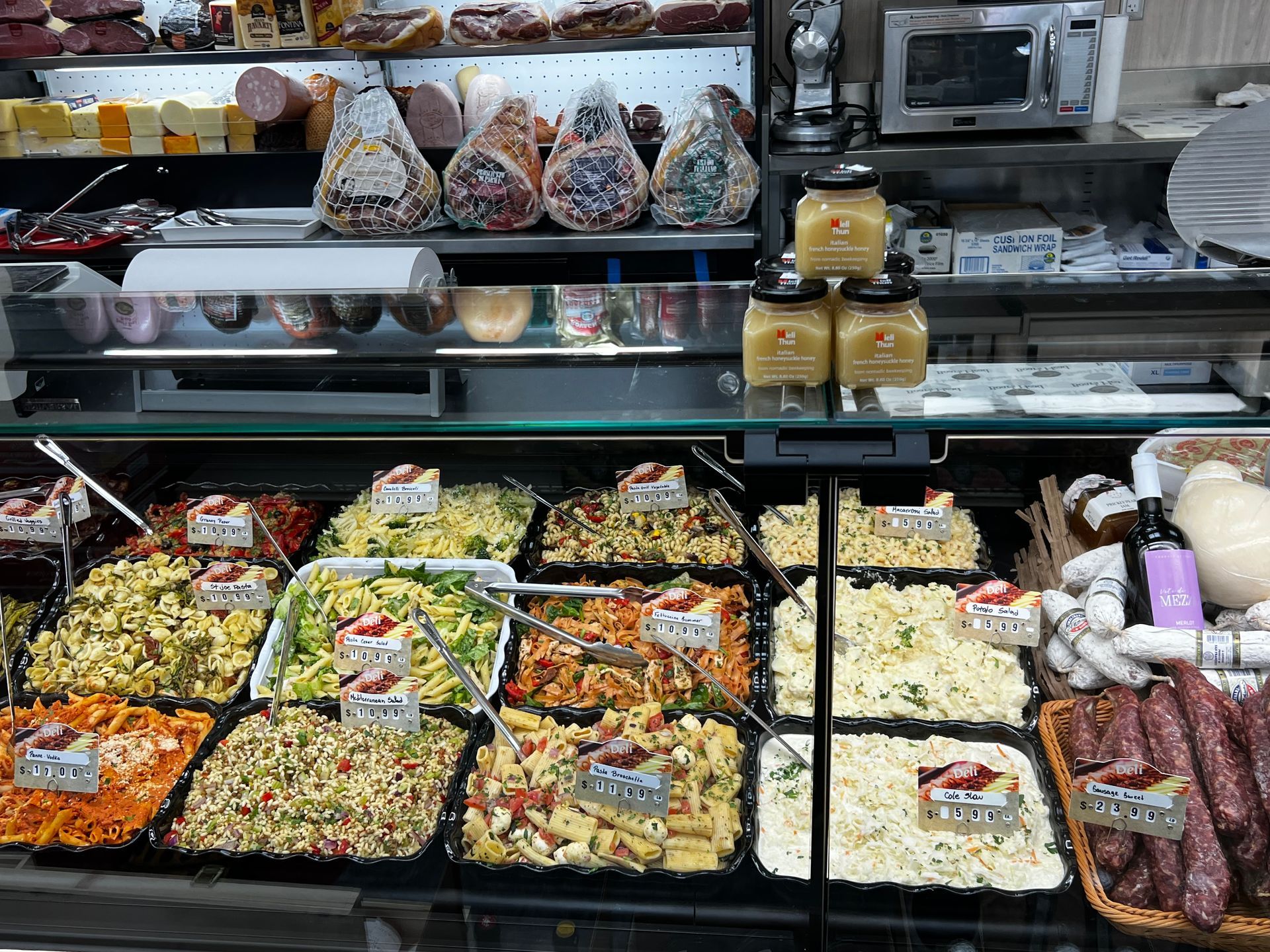 A display case filled with lots of different types of food