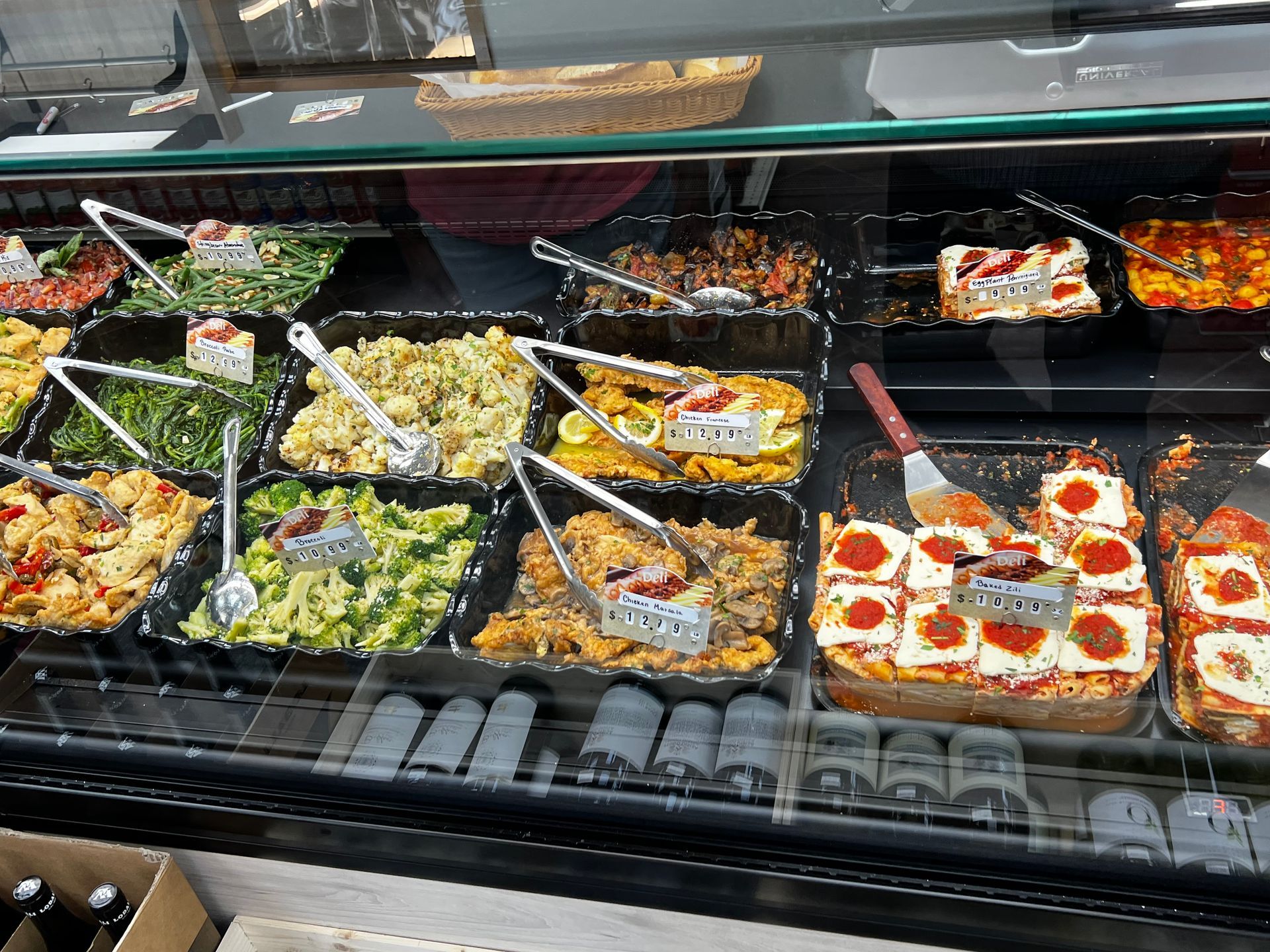 A display case filled with lots of different types of food