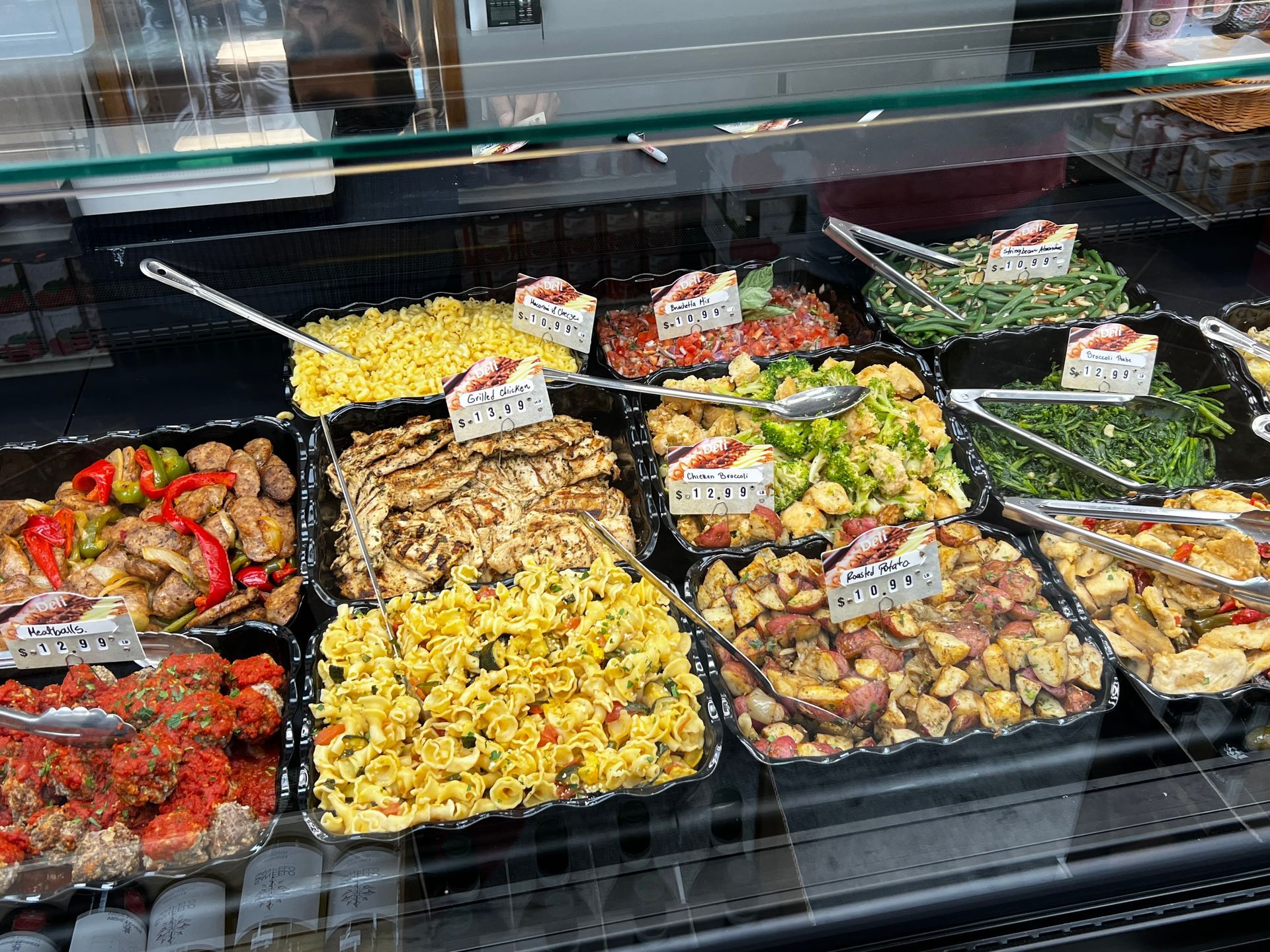 A display case filled with lots of different types of food.
