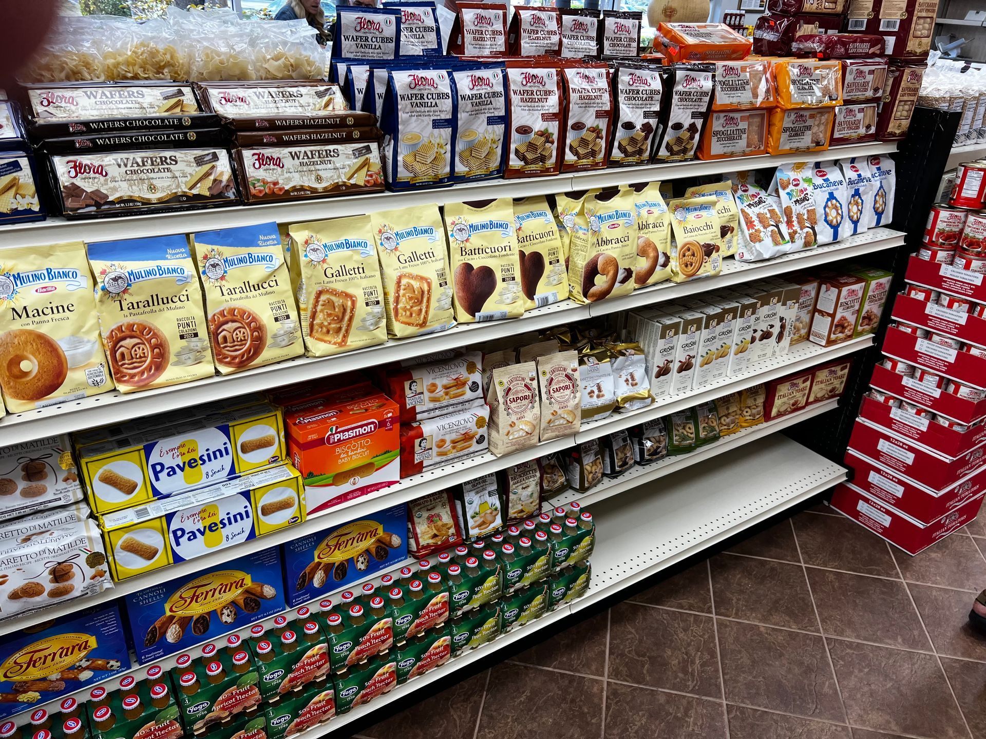 A grocery store aisle filled with lots of food