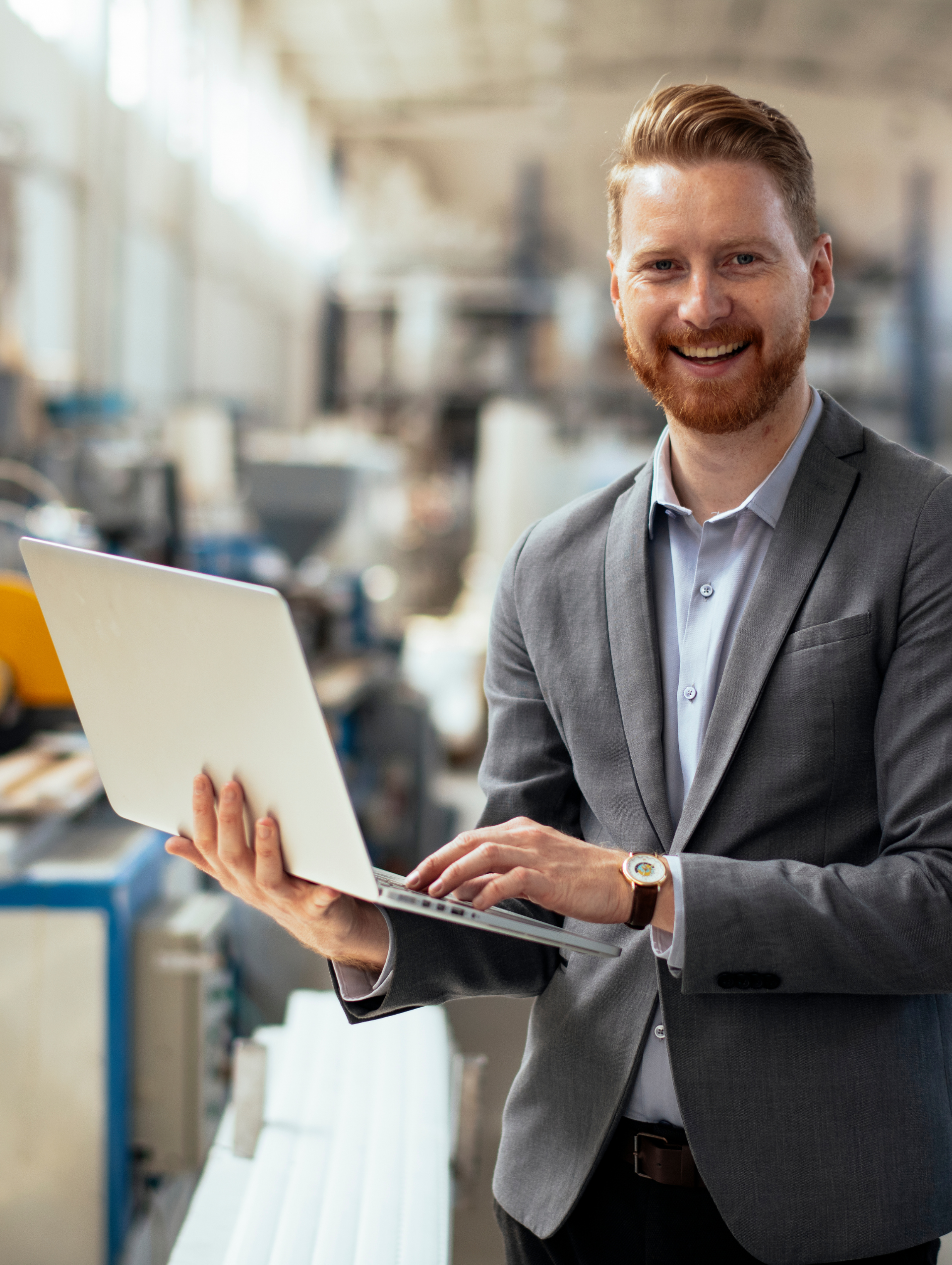 Man smiling in a professional setting