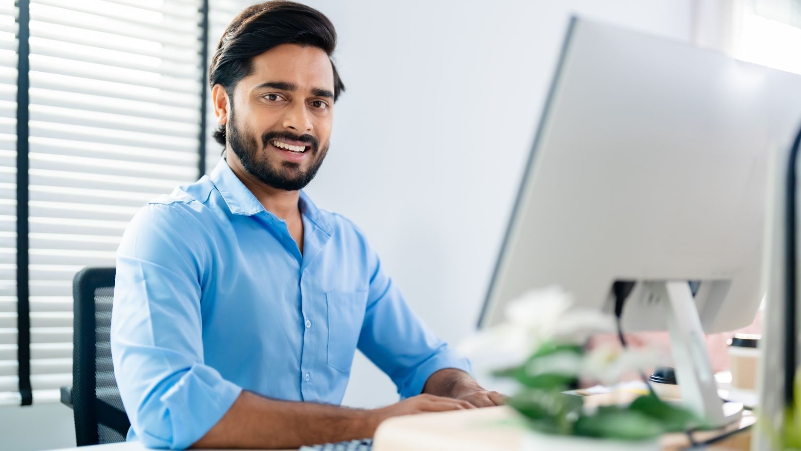 Man working on his computer in office