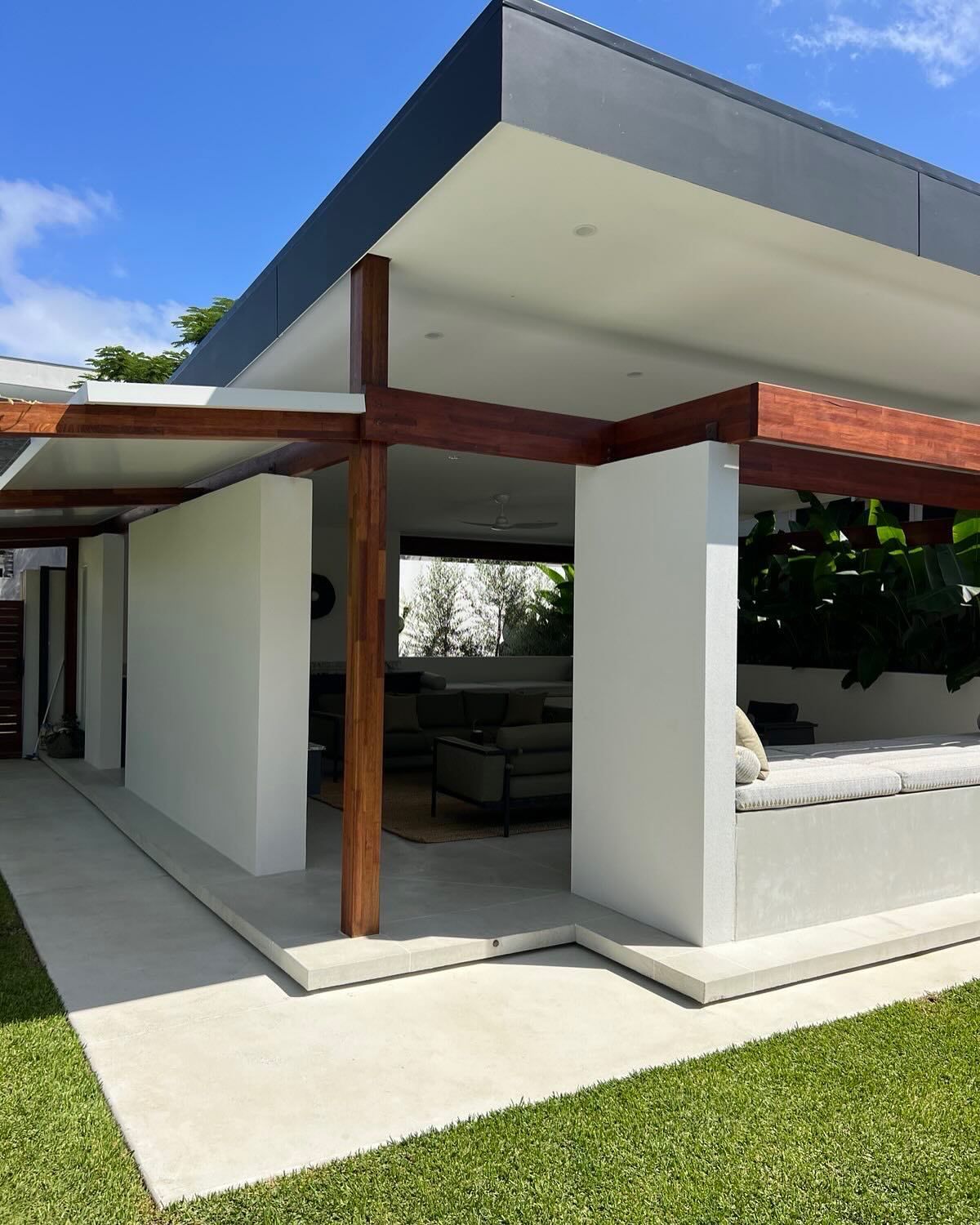 Honed alfresco area complimented by architectural concrete bench and lanscaping
