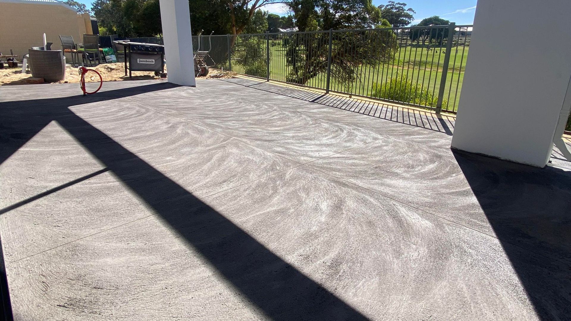 Coloured Concrete patio with golf course in the back