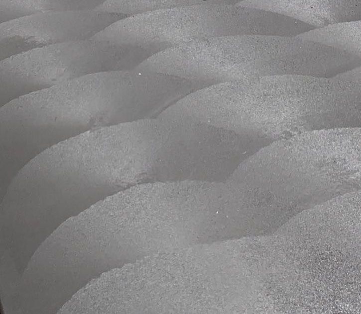 Charcoal coloured concrete path in backyard of Perth