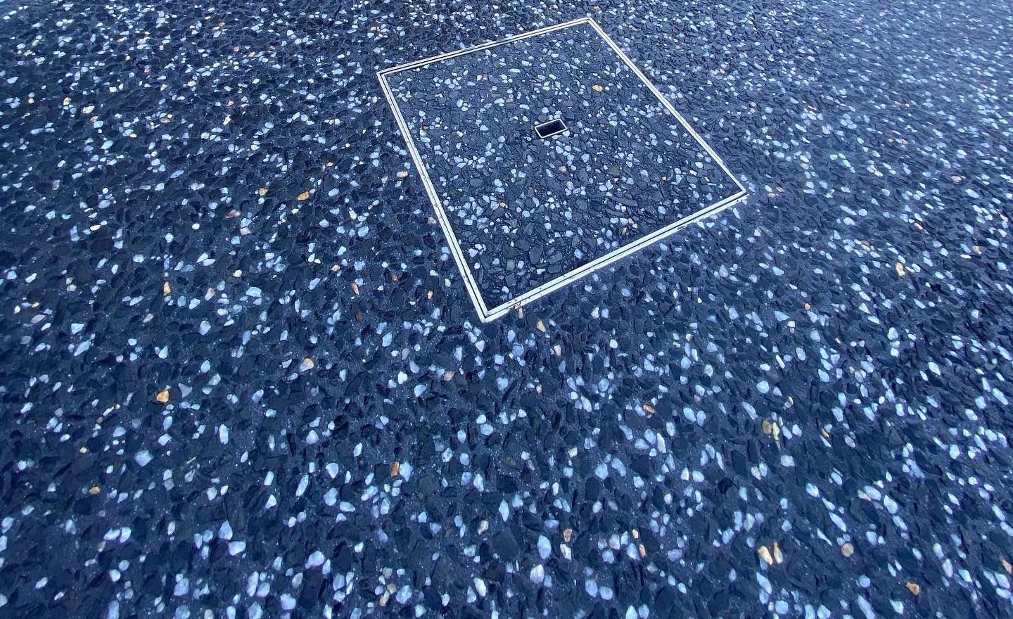 Charcoal exposed aggregate driveway with drainage