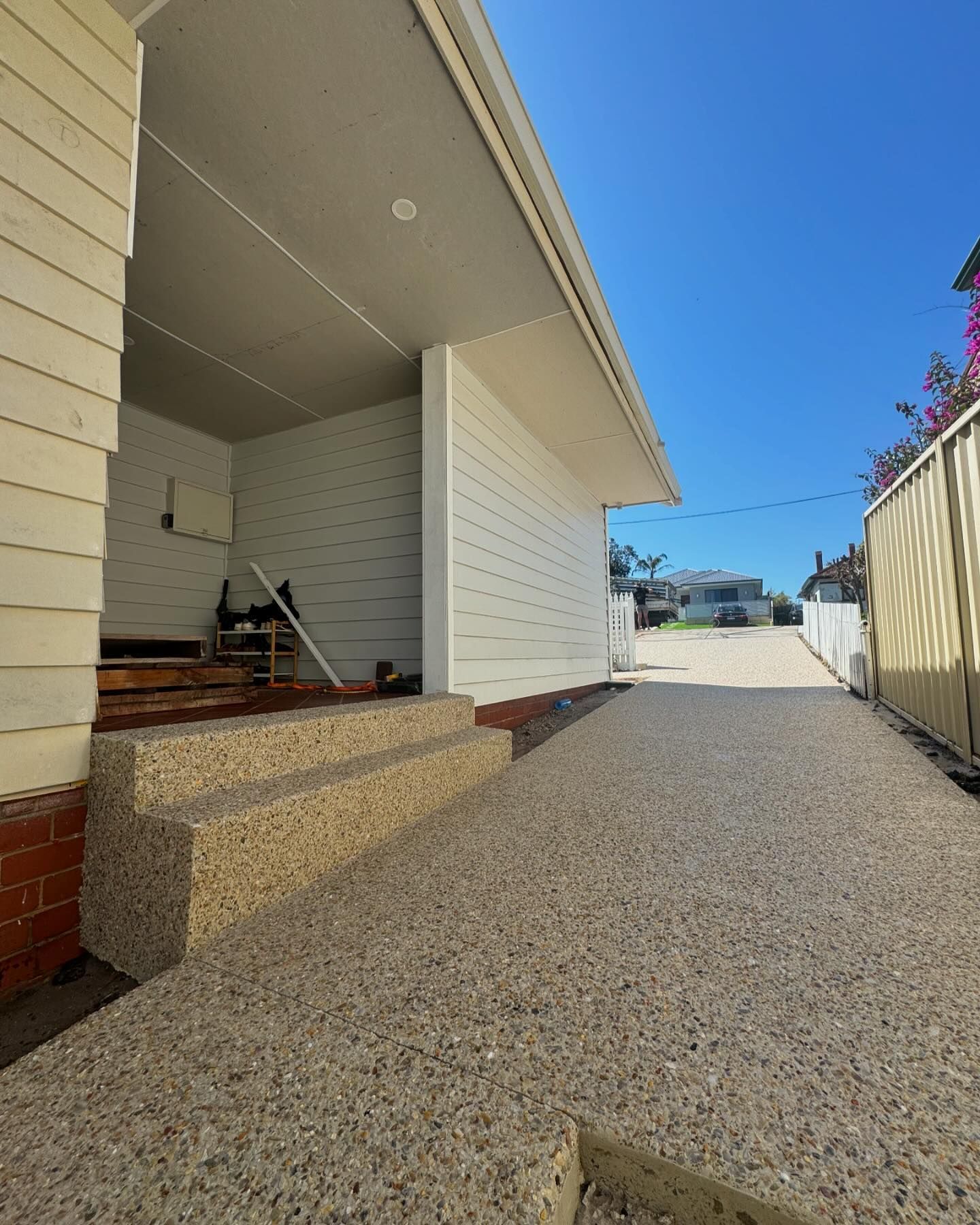 Exposed driveway with concrete stairs