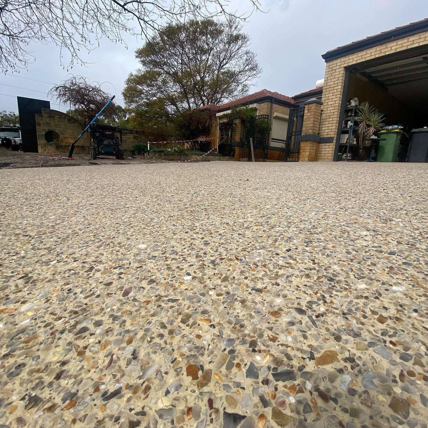Magnolia Mix Exposed Aggregate Concrete Driveway.