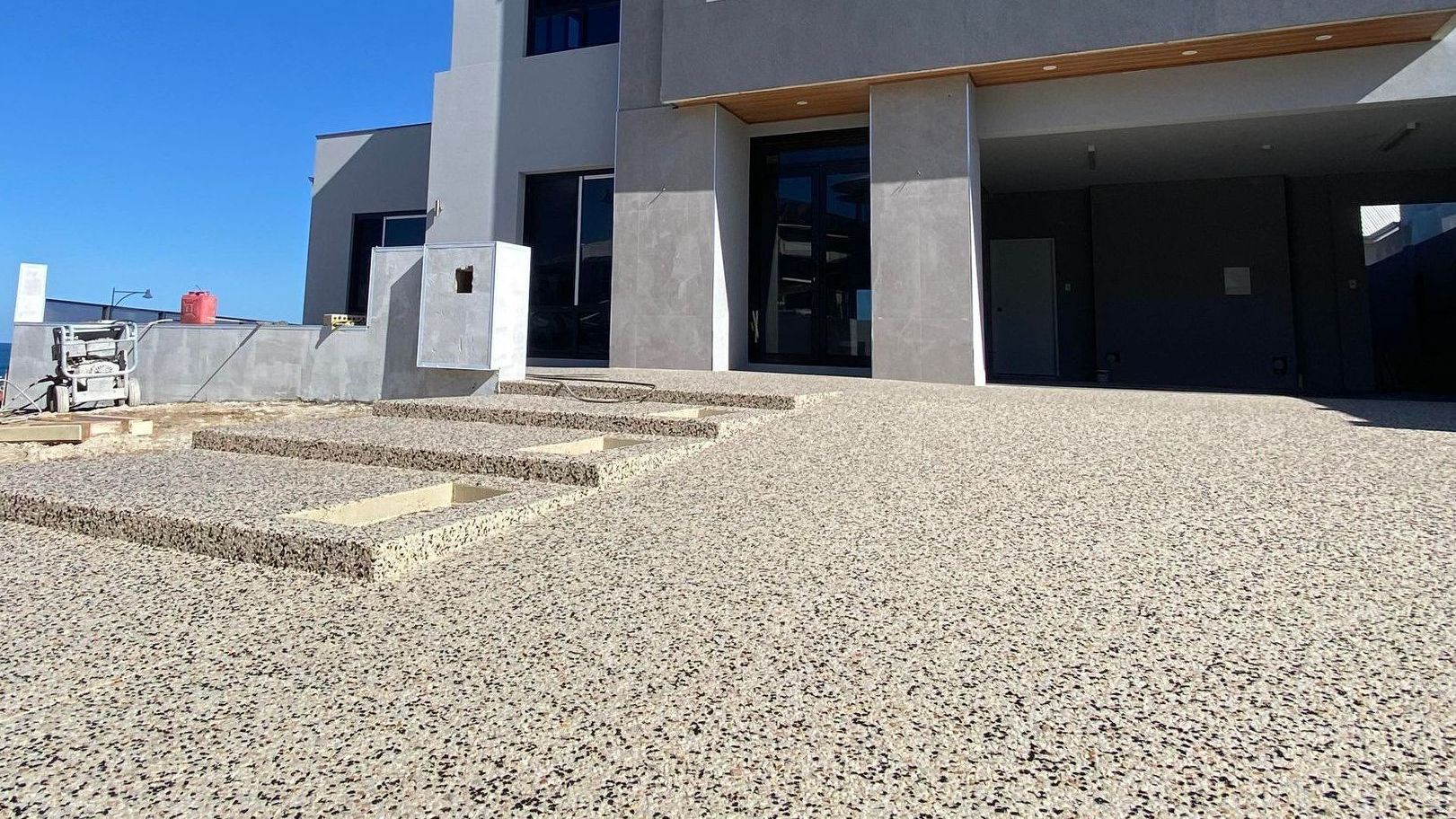 Seamless Exposed Aggregate Stair Case Leading to Front Door