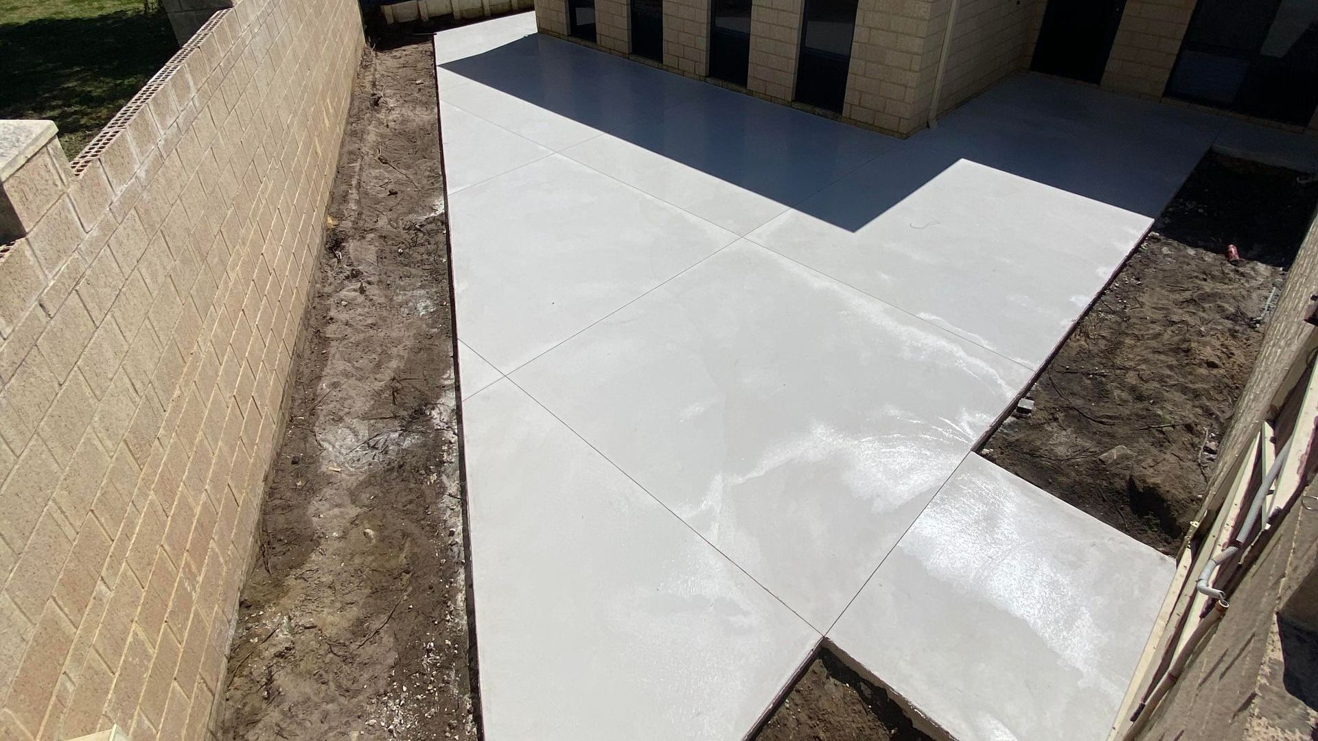 White Coloured Concrete Patio in Perth Homes Backyard