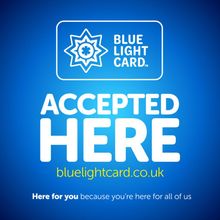 A blue sign states that the Blue Light Card is accepted here, with the website bluelightcard.co.uk and a slogan below.