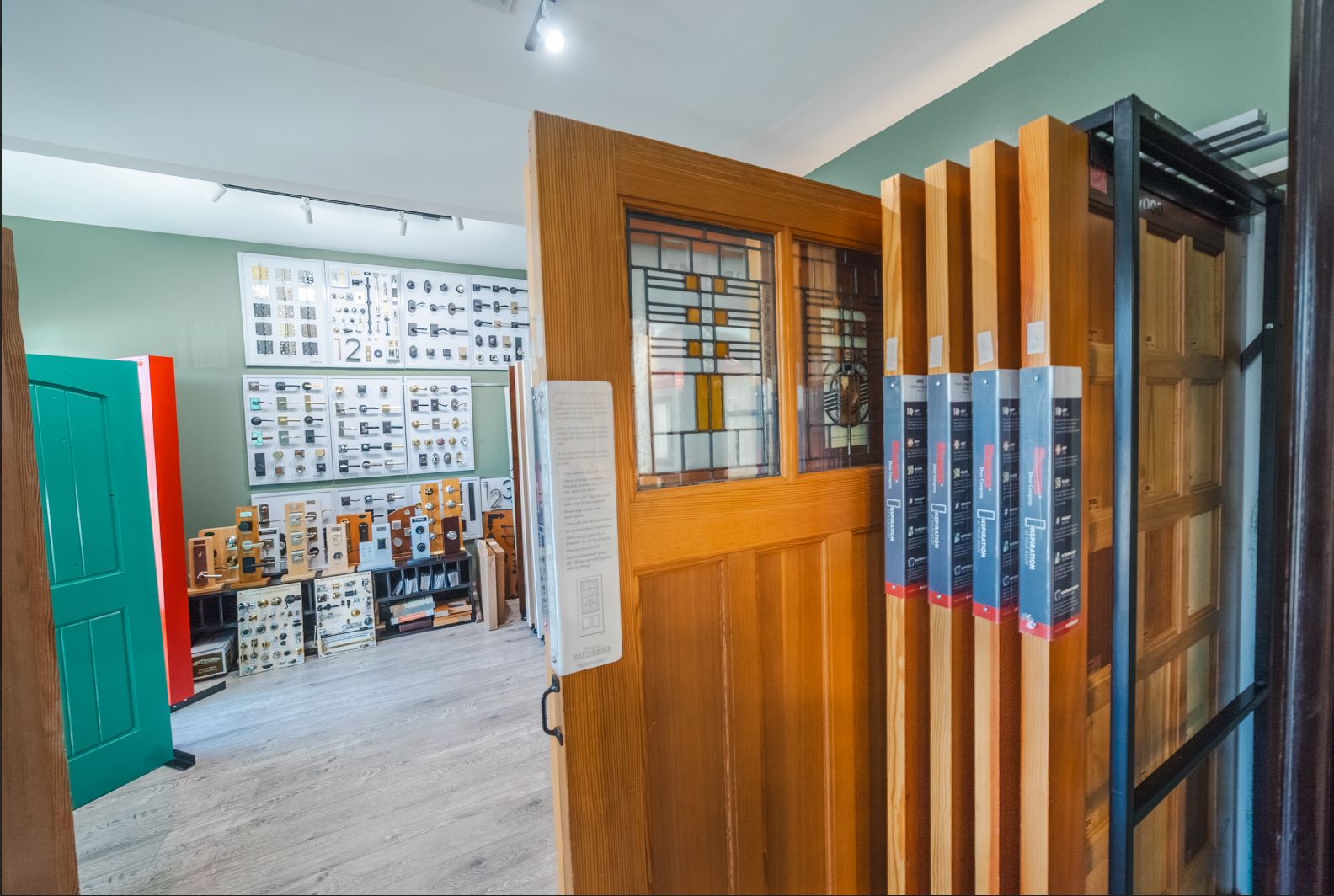 Interior door showroom displays various door styles, colors, and hardware options.