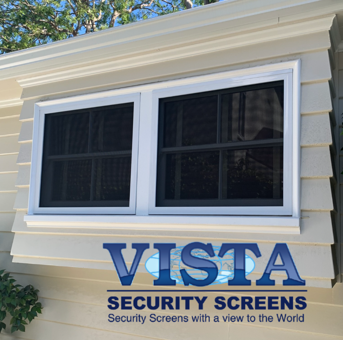 White window with security screens installed on a tan house.
