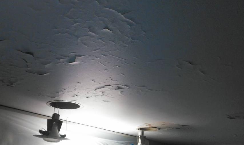 Kitchen drywall installation in progress.