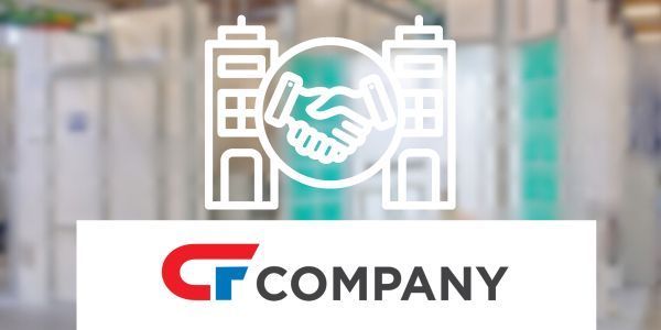 a logo for a company with a handshake in the middle of a building .