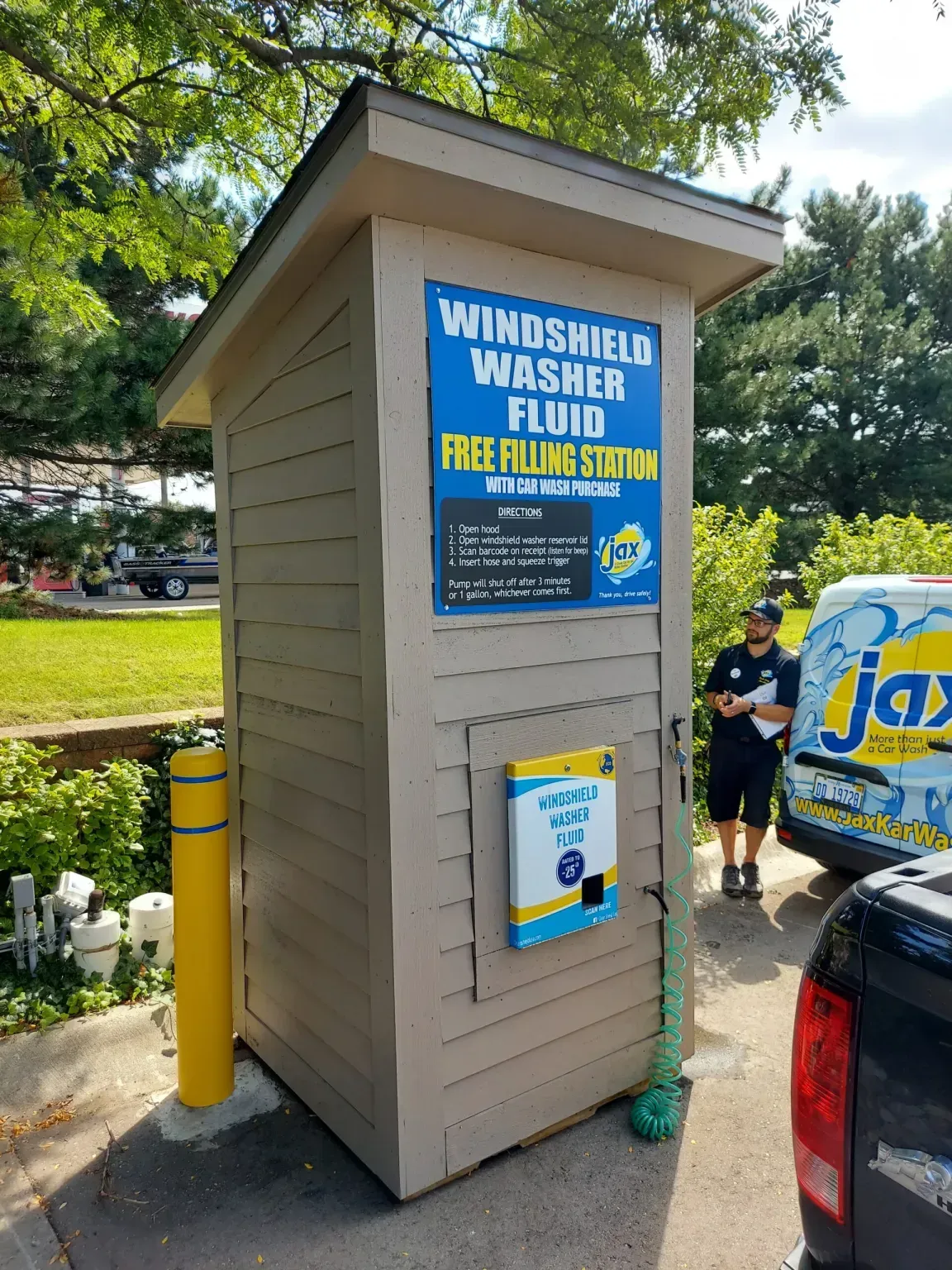 A small building with a sign that says windshield washer fluid
