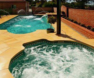 swimming pool with nearby hot tub