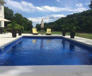 in-ground swimming pool with dark liner