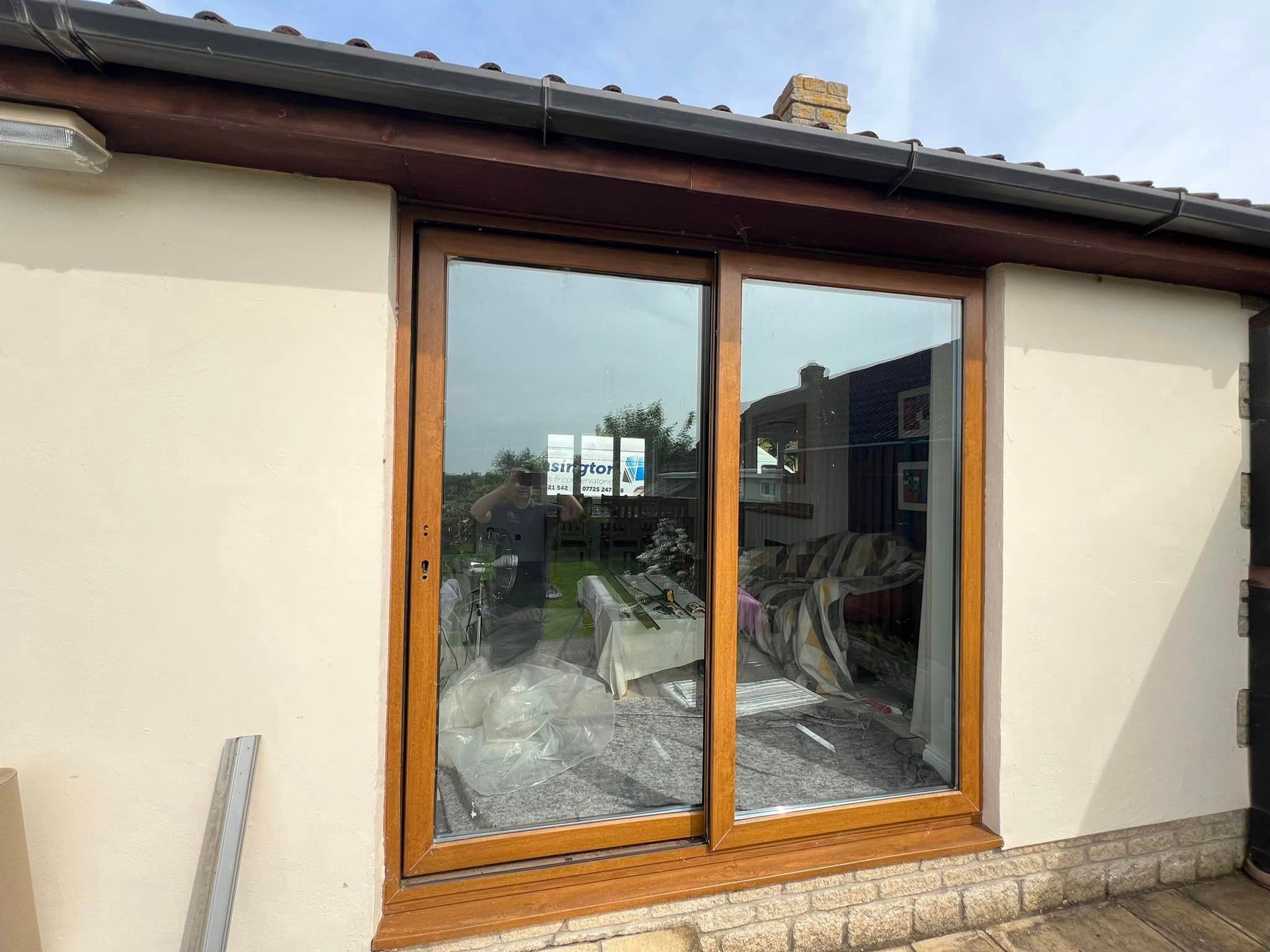A house with a sliding glass door on the side of it.